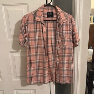 Never worn.  Pink plaid hollister button down short sleeve.